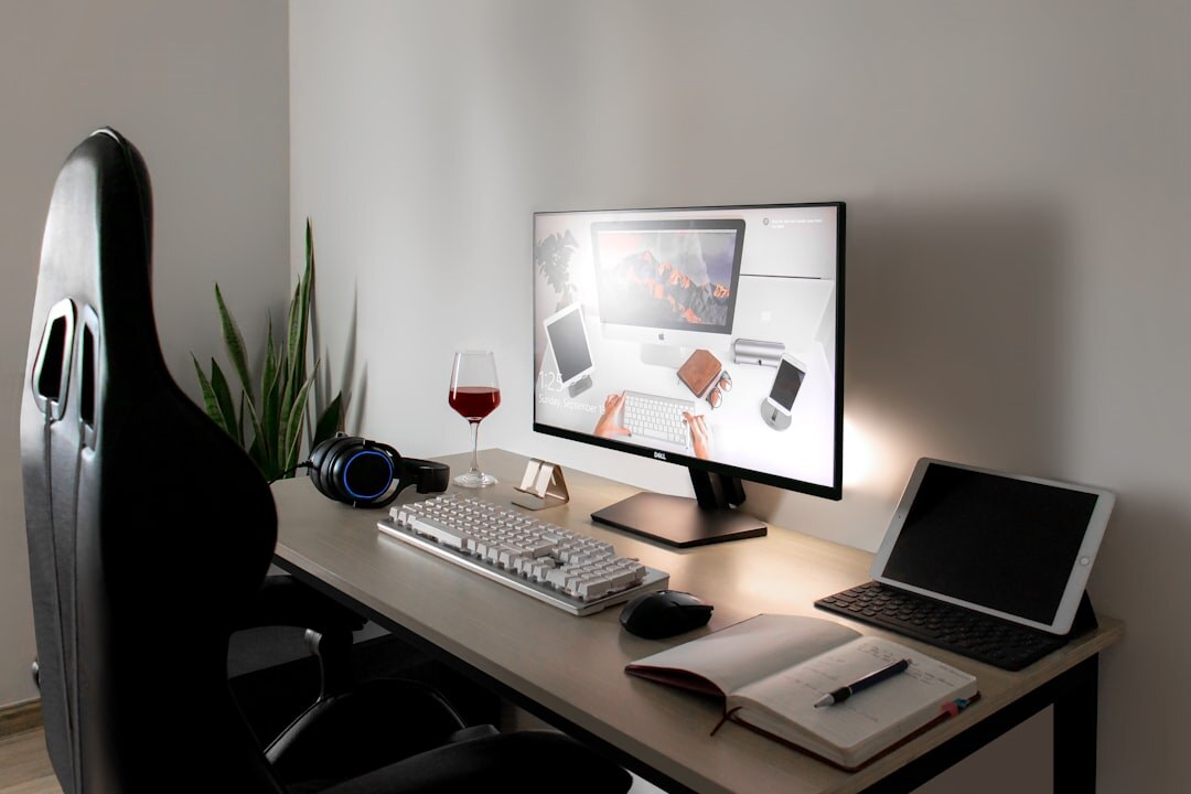Modern newsroom desk with monitors and notebooks