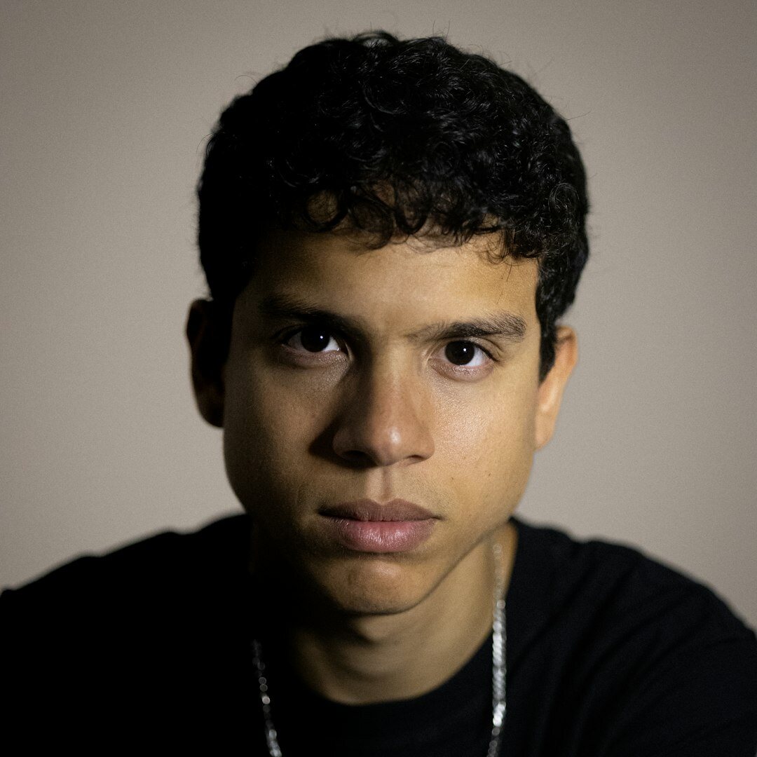 Studio portrait of a Latino male photographer